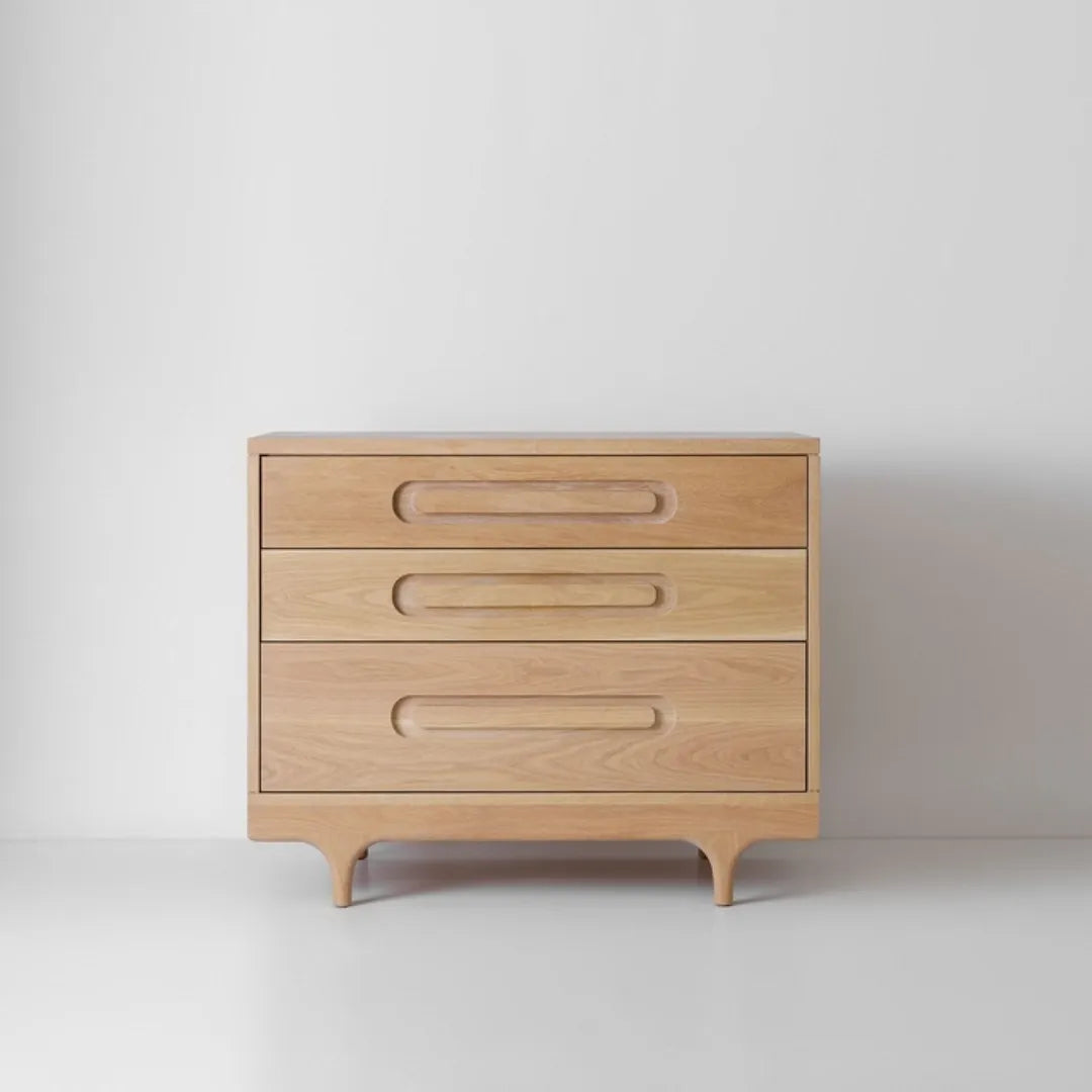 modern wooden chest of drawers with curved handles and elegant legs