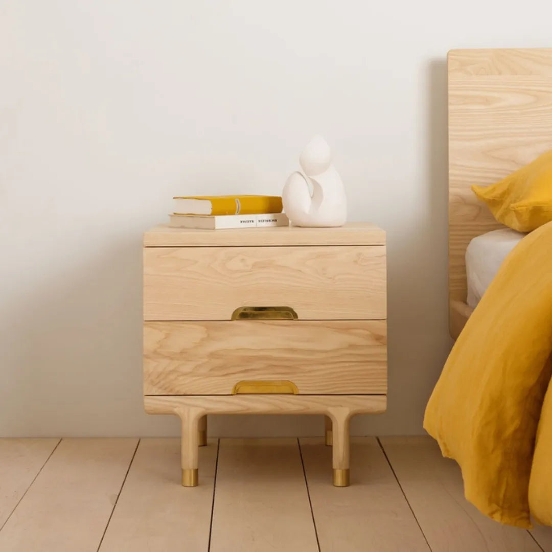 modern wooden nightstand with brass legs and two drawers